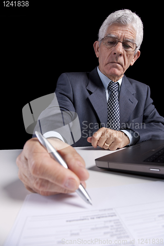 Image of Senior businessman at the office