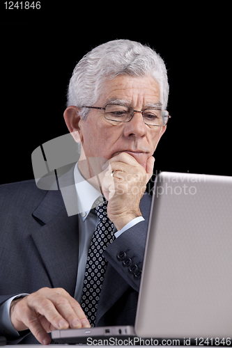 Image of Senior businessman at the office