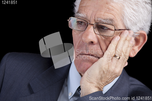 Image of Senior businessman thinking