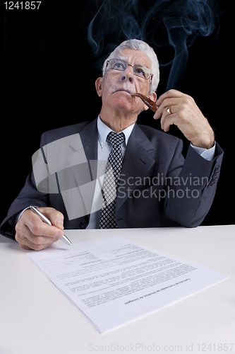 Image of Senior businessman at the office