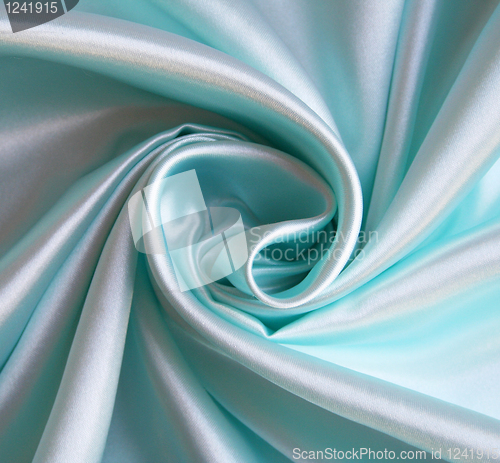 Image of Smooth elegant blue silk as background 