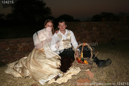 Image of Wedding Couple having a picnic