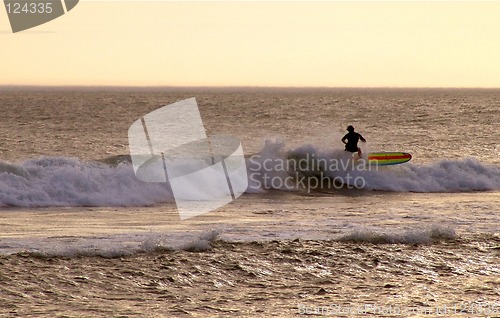 Image of Surfing on a sun down