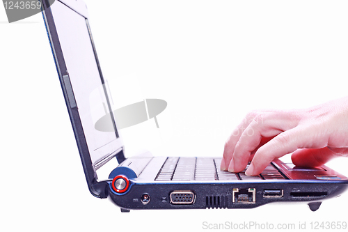 Image of Image of hand on the laptop keyboard