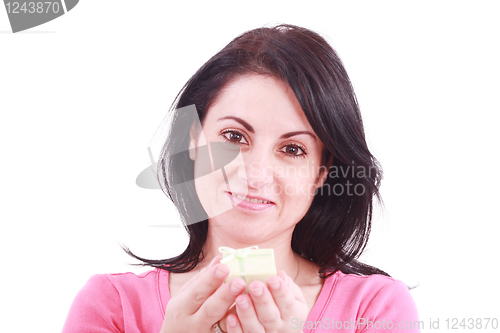 Image of Portrait of a beautiful young woman offering a present in a white background