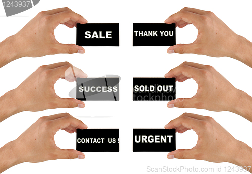 Image of black business card in hand with text