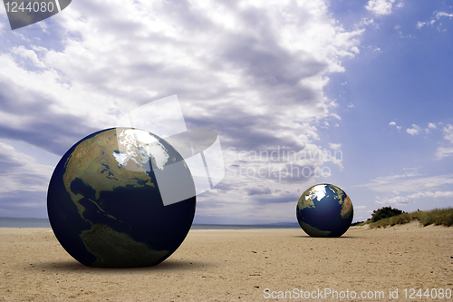 Image of 3d earth on a beach