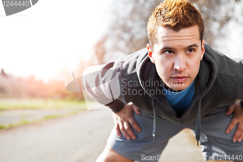 Image of Mixed race man stretching