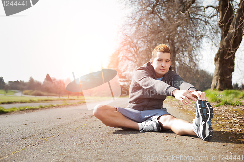 Image of Mixed race man stretching