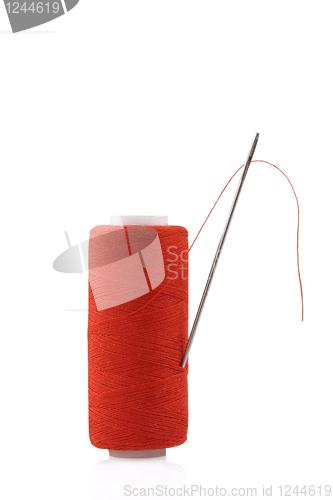 Image of red spool with needle