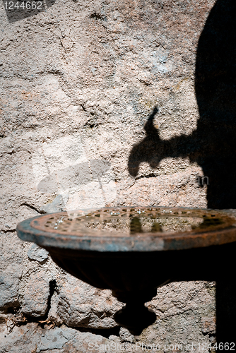 Image of Shadow of an olld water pump