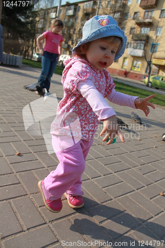 Image of little girl run on walk