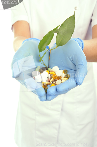 Image of young doctor with pills  