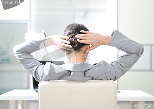 Image of businesswoman resting in the arm-chair  