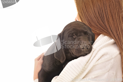 Image of Young woman and sweet puppy  