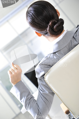 Image of businesswoman resting in the arm-chair   