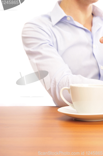 Image of  young man with a cup of tea 