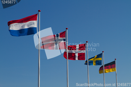Image of Flags on a blue sky