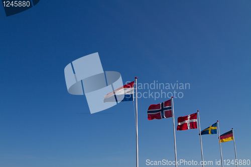 Image of Flags on a blue sky
