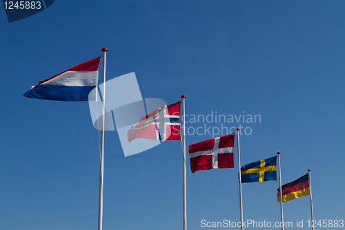Image of Flags on a blue sky