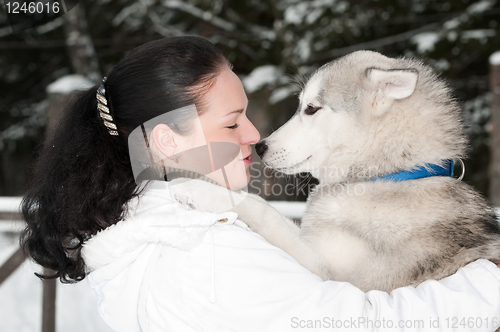 Image of happy siberian husky owner with dog