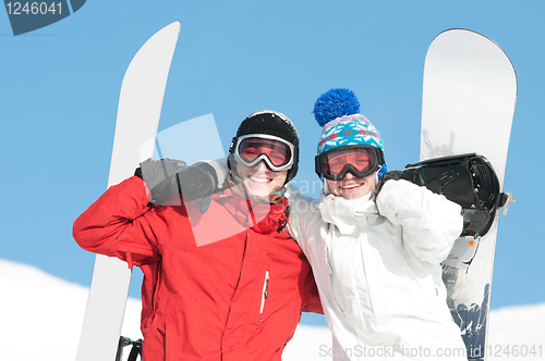 Image of Happy sportsman with snowboards