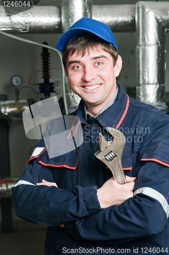 Image of heating engineer in boiler room