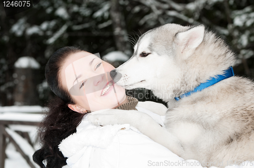 Image of happy siberian husky owner with dog