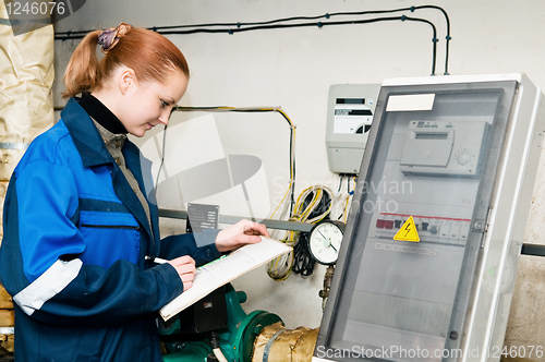 Image of woman engineer in a boiler room