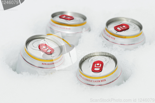 Image of beer cans in winter snow