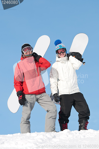 Image of Happy sportsman with snowboards