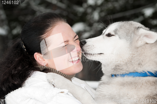 Image of happy siberian husky owner with dog