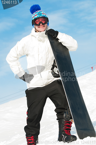 Image of Happy sportsman with snowboards