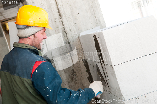 Image of builder mason at bricklaying work