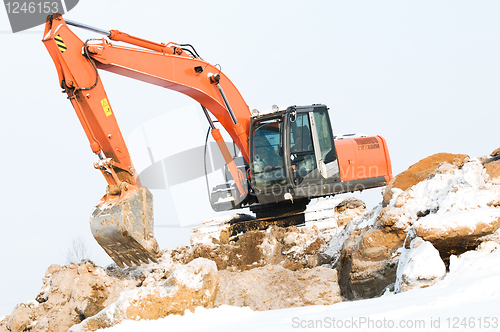 Image of excavator loader at winter works