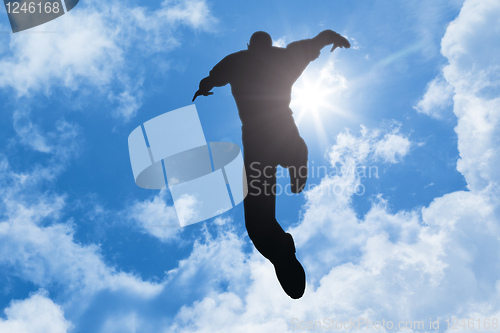 Image of bright sun man jumping