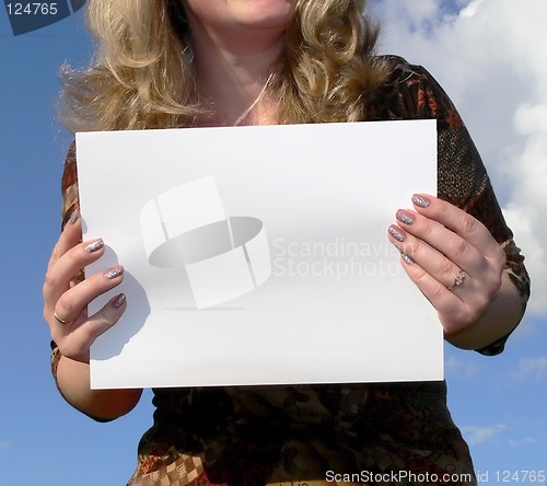 Image of woman holding a white card