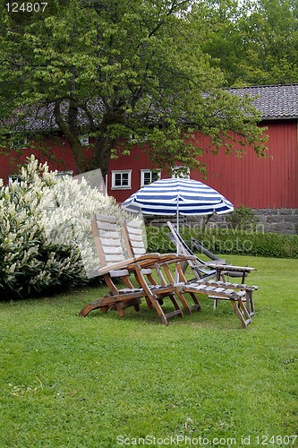 Image of Teak chairs in the garden