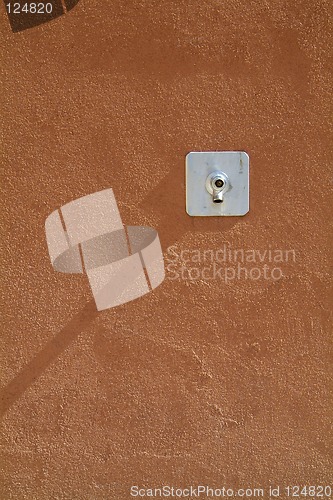 Image of Water tap on a concrete wall