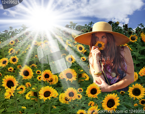 Image of Young Beautiful Woman on a Field in Summer Time