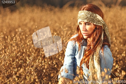 Image of Beautiful Woman on a Field in Summertime 