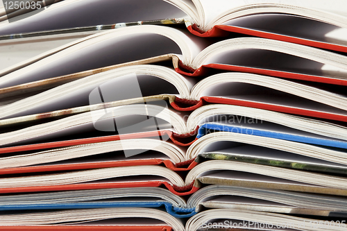 Image of pile of book with bending pages