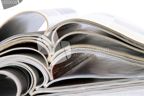 Image of Pile of magazines with bending pages