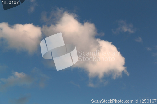Image of Fluffy clouds in the blue sky