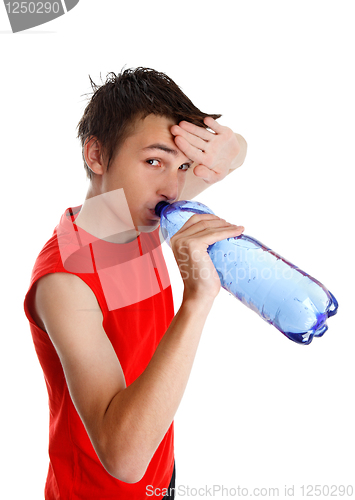 Image of Sweaty boy drinking bottled water
