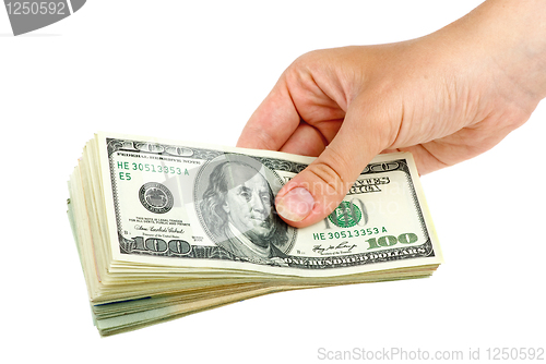 Image of Hand giving pack of $100 banknotes