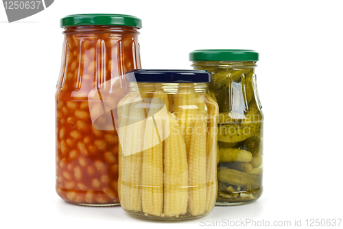 Image of Glas jars with cornichons, haricot beans and corn ears