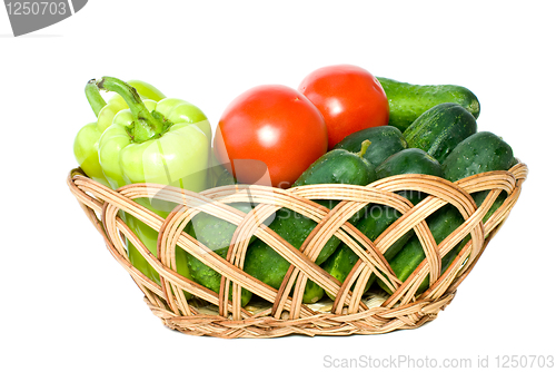 Image of Basket with some cucumbers, tomatoes and sweet peppers