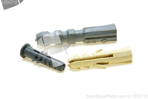 Image of Three plastic dowels