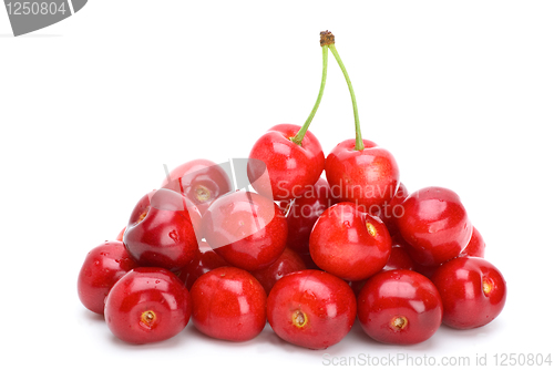 Image of Pile of red cherries without stalks and pair berries on the top